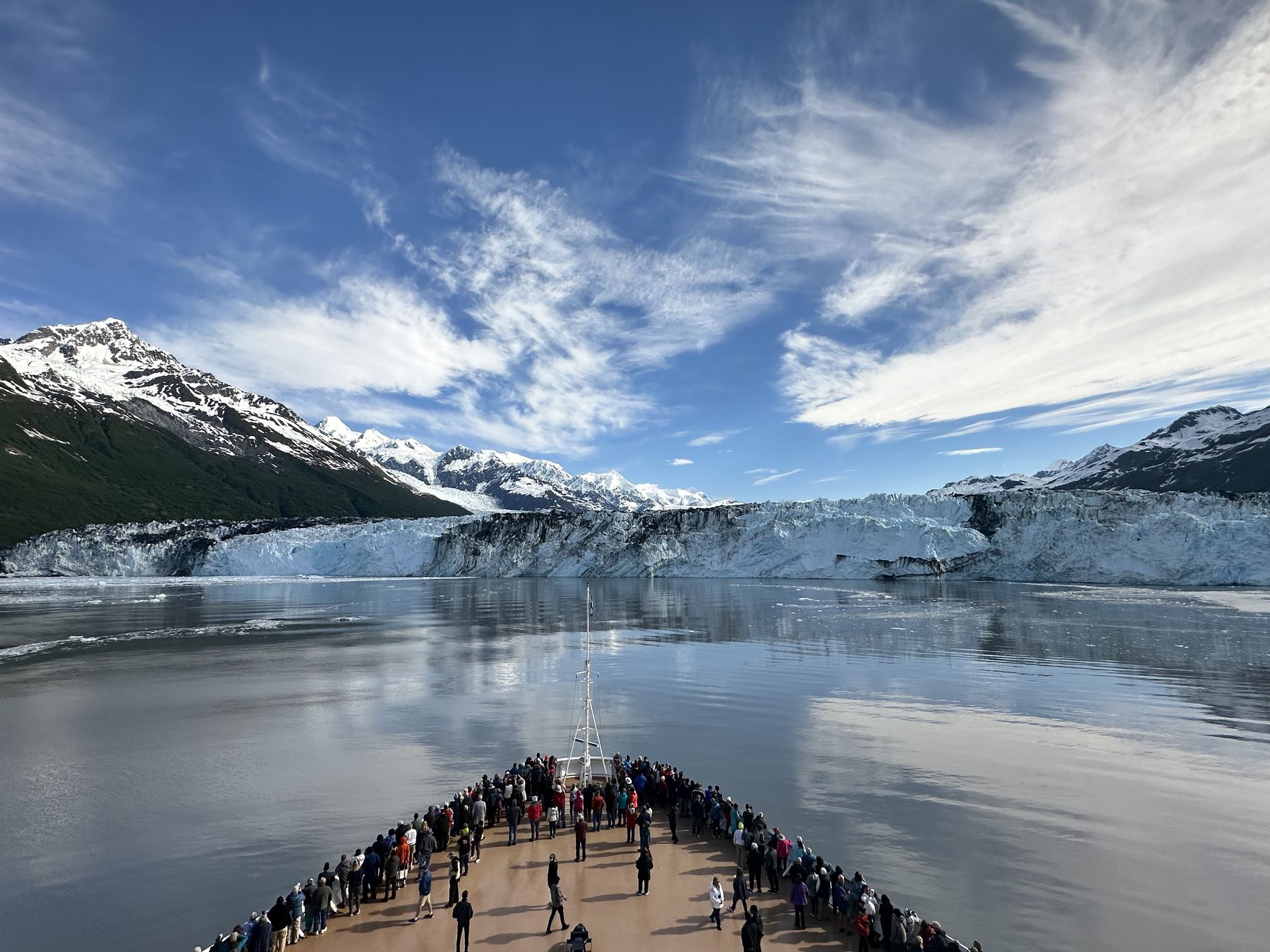 A cruise ship's bow facing a tidewater glacier in College Fjord