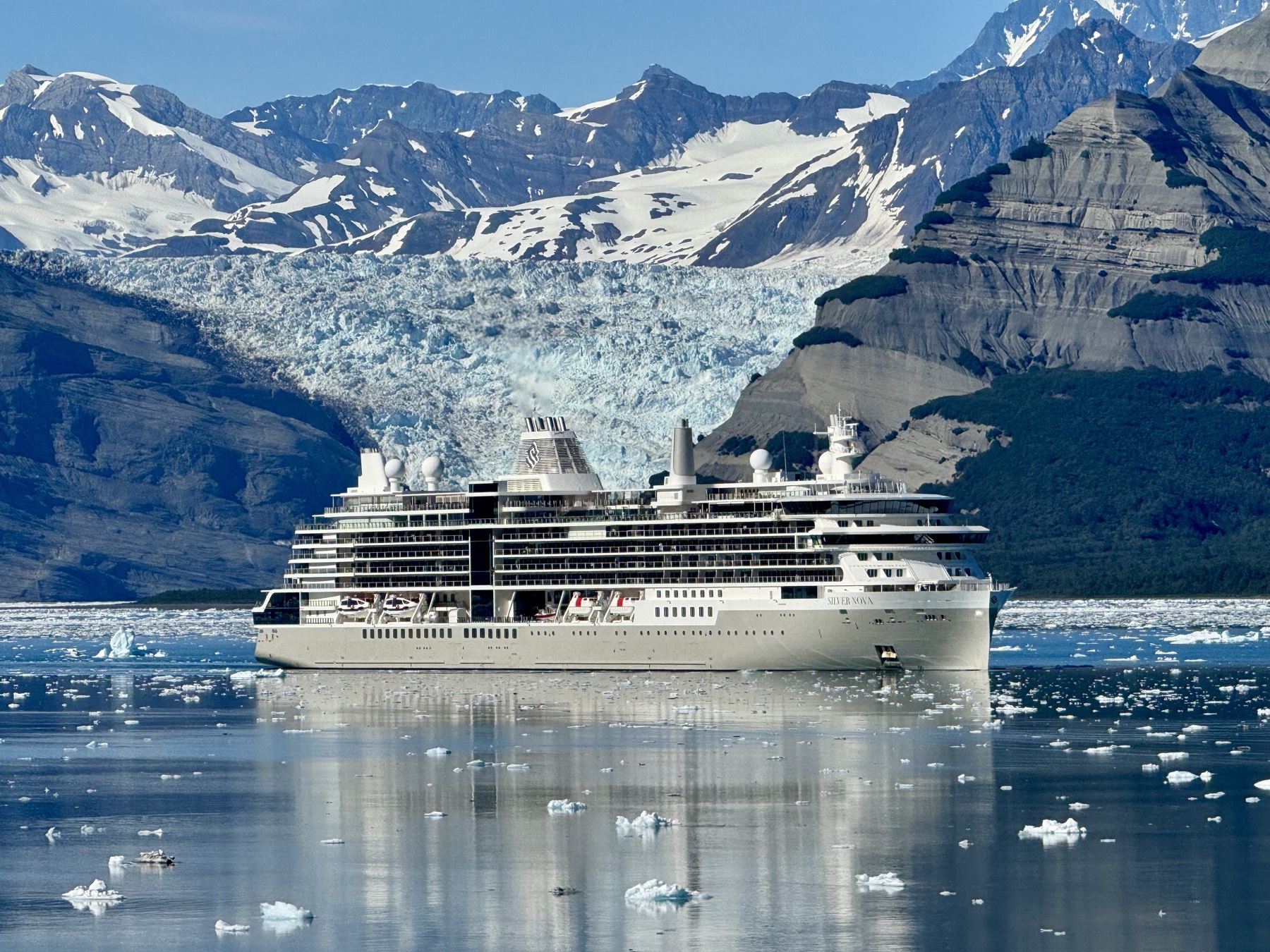 A cruise ship before a tidewater glacier in Icy Bay on the Gulf of Alaska