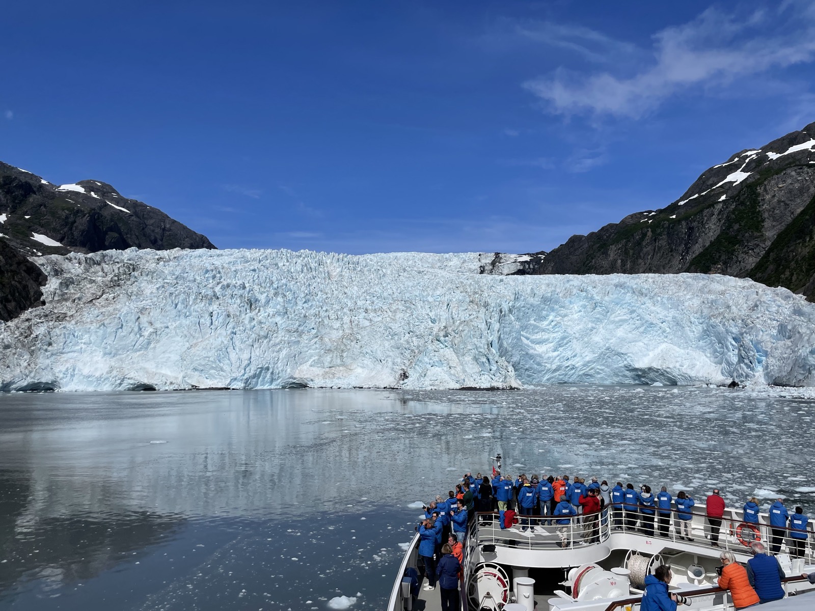 A tour vessel before a tidewater glacier in the Kenai Fjords