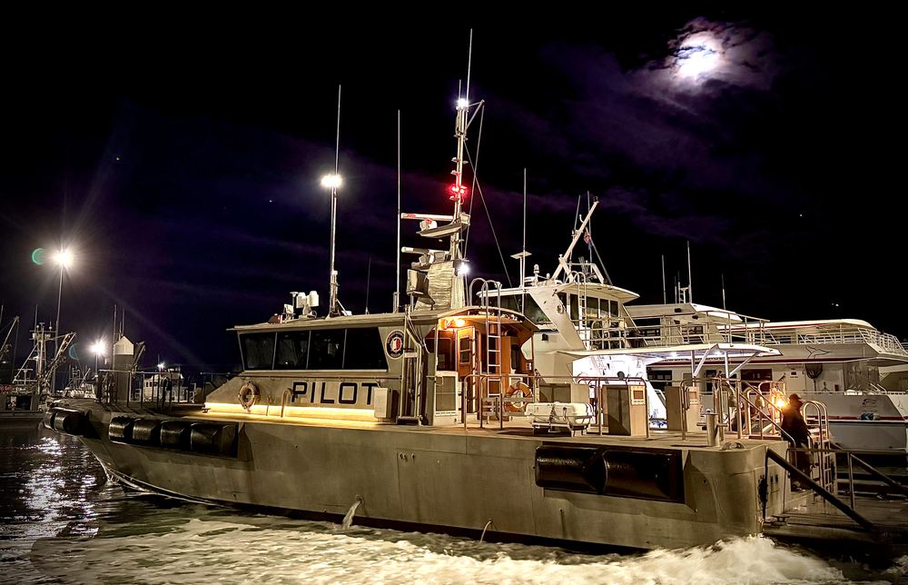 A pilot boat at its Valdez dock at night