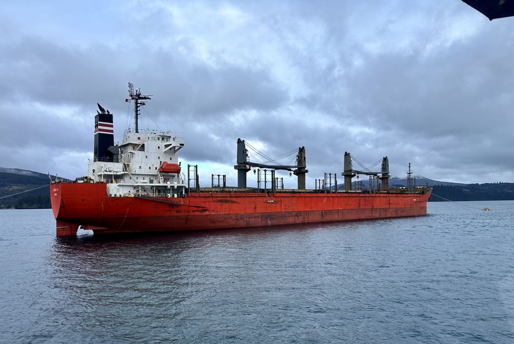 A bulk carrier at anchor near Kodiak Island