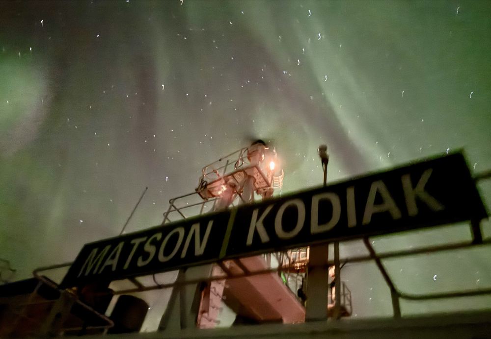Northern lights over a ship's bridge wing in Cook Inlet