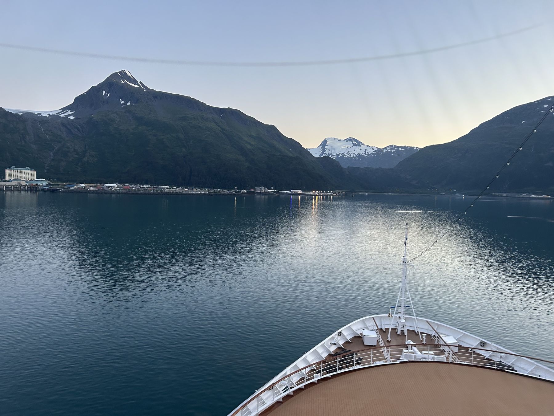 A cruise ship's bow approaching Whittier at the head of Passage Canal